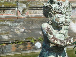 Fototapeta na wymiar Art sculpture and carved antique deity angel god of hindu statue balinese style