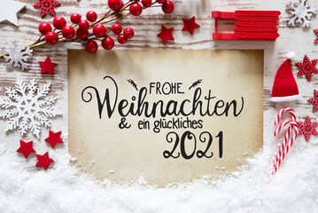 Obraz na płótnie Canvas Paper With German Calligraphy Frohe Weihnachten Und Ein Glueckliches 2021 Means Merry Christmas And A Happy 2021. Bright Red Christmas Decoration Like Ball, Sled And Snowflake