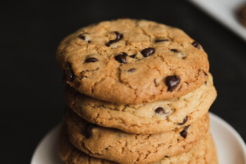 Delicious stacked chocolate chip cookies - tower of homemade cookies fresh from the oven