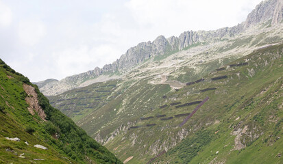 Fototapeta na wymiar Snow and rock fence in high mountains