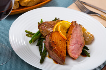Top view of roasted duck breast with asparagus. High quality photo
