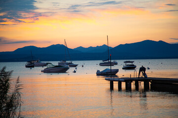 Sunset with landing stage in Bardolino, Italy