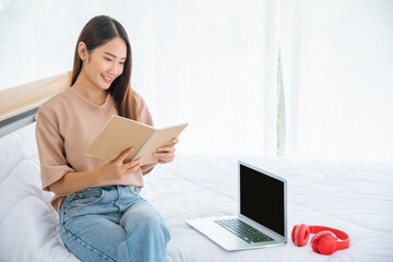 Relax woman holding book read at bookshelf in university library. Young woman relaxation reading open book leisure mind. Smart beautiful woman clever person in knowledge intellectual learning center