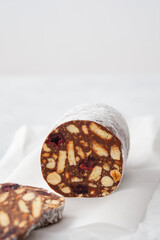 Chocolate salami or chocolate chorizo is a traditional Portuguese dessert made from dark chocolate, broken cookies, butter, eggs and a bit of port wine or rum. It is popular throughout Europe