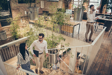 Top above high angle view full size photo of focused man woman boss promoter go upstairs discuss anti crisis start-up innovation project strategy in workstation