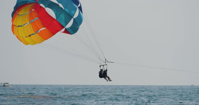 Parachute flying over the sea.