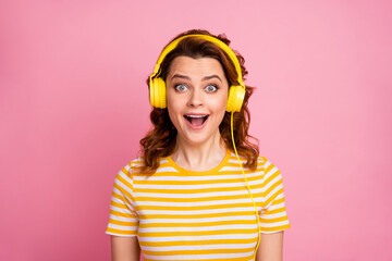 Close-up portrait of her she nice-looking attractive lovely cute pretty charming glad cheerful cheery wavy-haired girl listening music having fun isolated over pink pastel color background