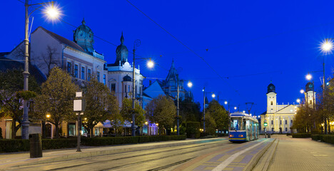 Nightlife of illuminated central Debrecen streets with Great Protestant Church, Hungary