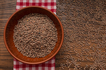 organic lentil legume in bowl and red napkin