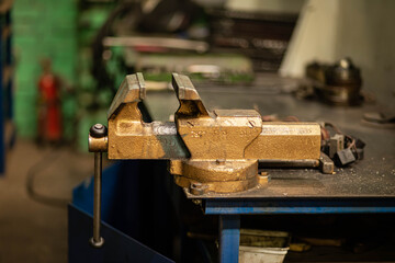 vise on the workbench, locksmith tool on the desktop