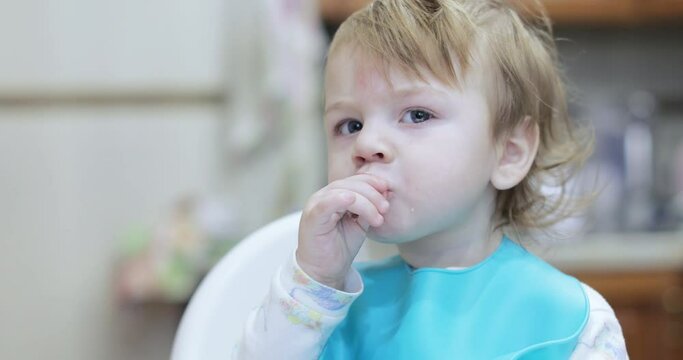 Boy eats lard and rusks