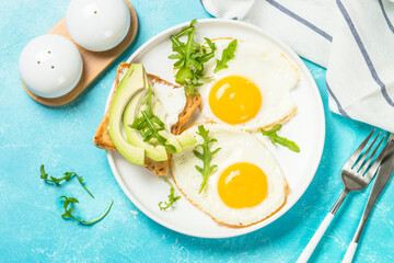 Healthy breakfast with egg, toast and salad.