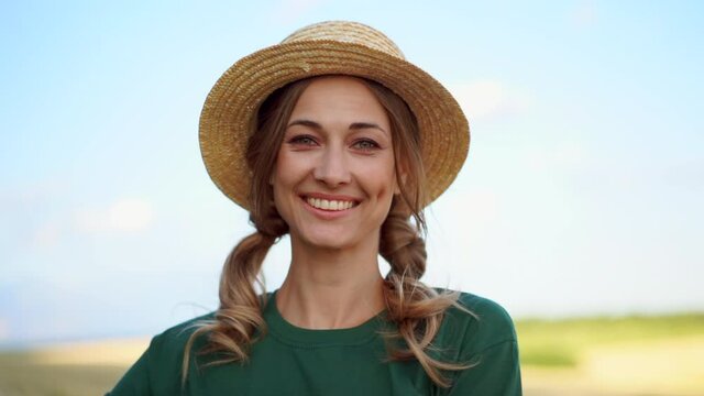Woman farmer straw hat holding basket vegetable onion tomato salad cucumber standing farmland smiling Female agronomist specialist farming agribusiness 