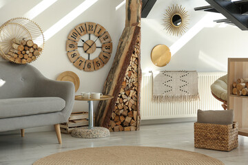 Stylish room interior with firewood as decorative element