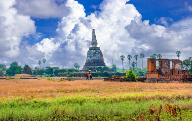 Tourists on an ride elephant tour in Wat Chang an abandoned temple one of a famous travel place in Ayutthaya.