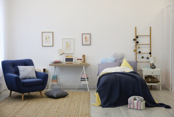 Modern teenager's room interior with bed and armchair
