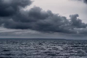 Foto auf Alu-Dibond dark stormy sea and dramatic clouds, gloomy nature © soleg
