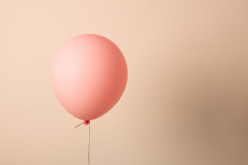Air balloon. Pink ball on a string. Balloon for the holiday.