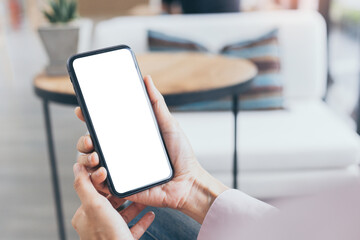 cell phone mockup blank white screen.woman hand holding texting using mobile on desk at coffee shop.background empty space for advertise.work people contact marketing business,technology