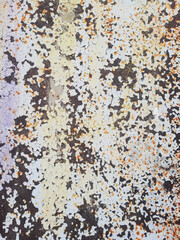 Rusty surface with peeled white paint texture