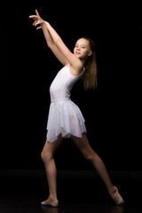 Naklejka premium Full length portrait of a charming gymnast girl in elegant dress.