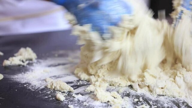 Chef Or Baker Making Dough At Bakery