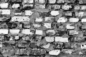 Texture of a brick wall with cracks and scratches which can be used as a background