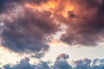 Naklejka na ściany i meble orange sunset sky with lighted clouds