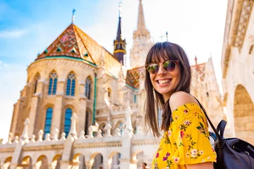 Zelfklevend Fotobehang A young woman enjoying her trip to the Castle of Budapest © Spectral-Design