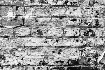 Obraz premium Texture of a brick wall with cracks and scratches which can be used as a background