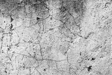 Texture of a concrete wall with cracks and scratches which can be used as a background