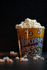 A bucket full of popcorn black background