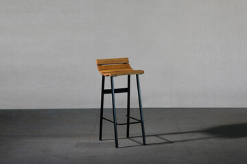 Closeup of a concave bar stool, loft-style