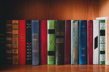 old color hardback books on the bookshelf. concept study, education