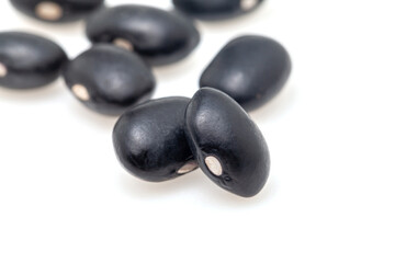 Pile of black beans isolated on white background. Top view.