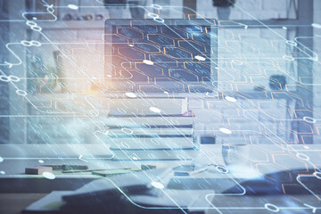 Multi exposure of desktop computer and technology theme hologram. Concept of software development.