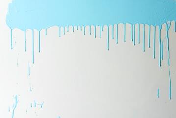 Blue paint dripping on white wall