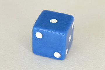 a blue die with a one on it