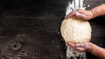 Hands of baker kneading dough. prepares ecologically natural pastries. banner, menu, recipe, place...