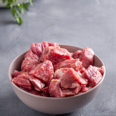 Raw marinated pork  meat  in a bowl.