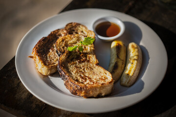 Toast Sliced with banana and honey displayed breakfast