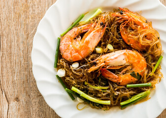 Baked prawns with noodles in plate , Thai famous food 