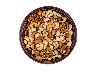 Various nuts (almond, cashew, hazelnut, pistachio, walnut) in ceramic plate isolated on a white background. Vegetarian meal. Healthy eating concept