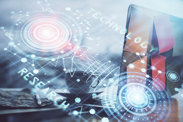 Double exposure of laptop computer and technology theme hologram. Concept of freelance work.