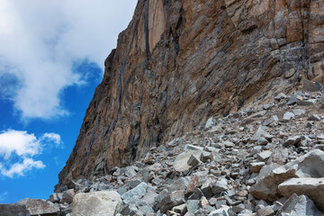 Fototapeta na wymiar Mountain landscape view in Kyrgyzstan. Stones and clouds in mountain valley view. Mountain panorama.