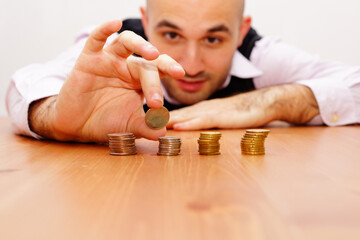 Caucasian male counting his coins