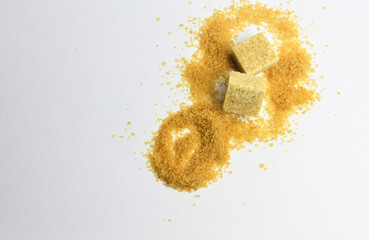 
Close up, outline scattered in small granules and sugar cubes, space for text