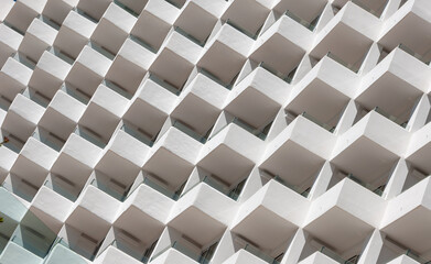 Abstract composition through balconies of a white facade