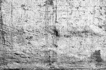Texture of a concrete wall with cracks and scratches which can be used as a background