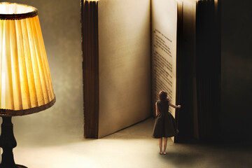 surreal moment of a woman opening the blank pages of a giant book, knowledge concept.